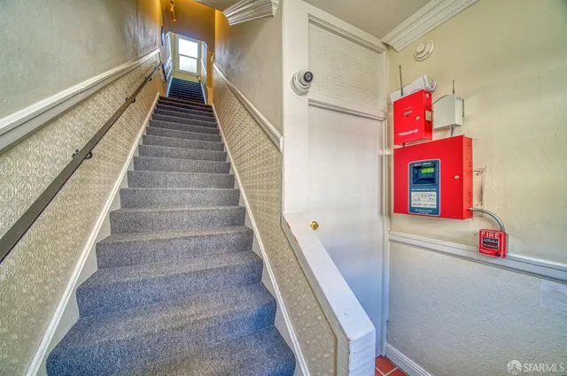 a utility room with wooden floor and entryway