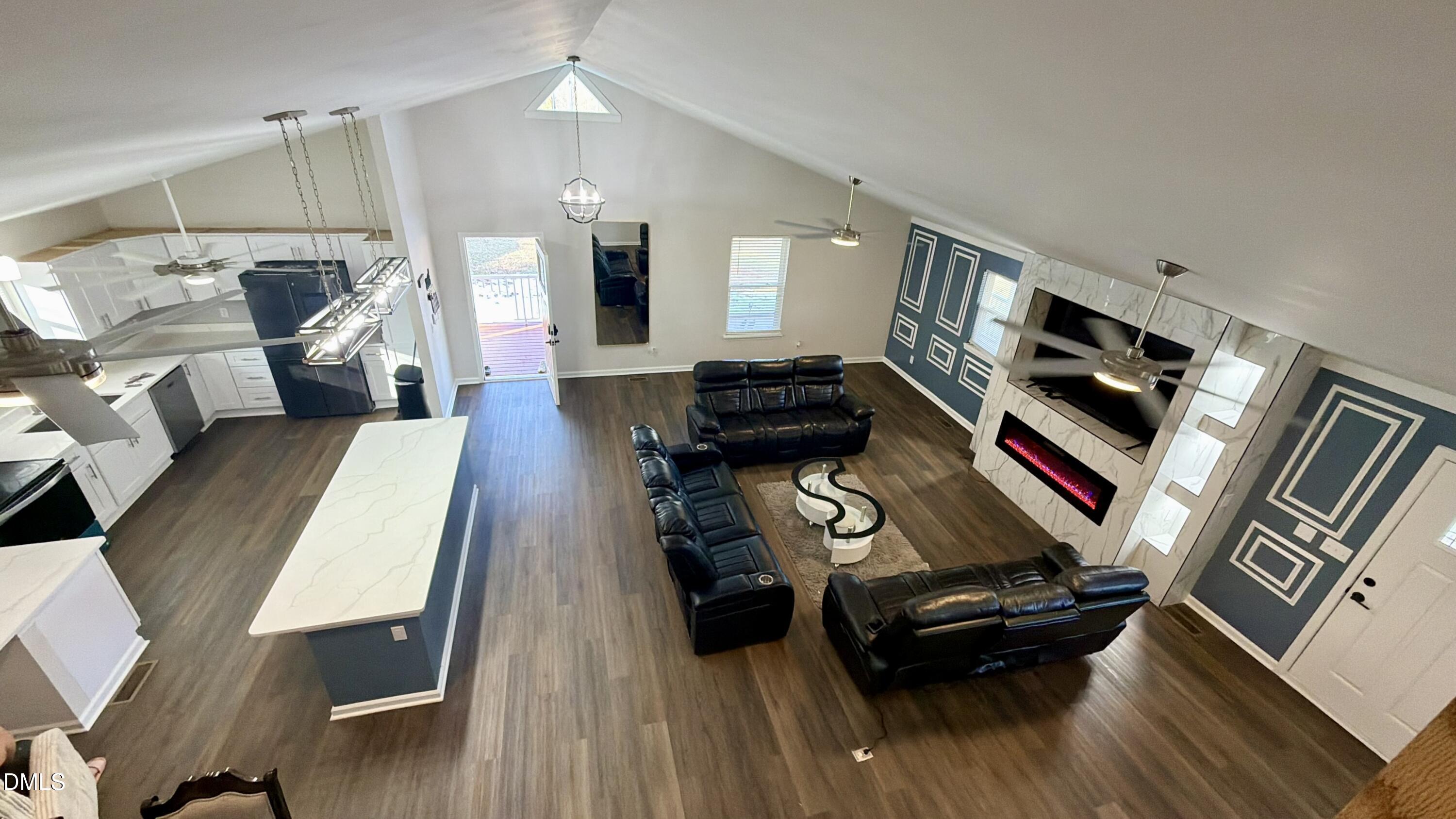 1696 James Winston Road Oxford, NC 27565 - Photo 12 of 19 a living room with furniture and a wooden floor