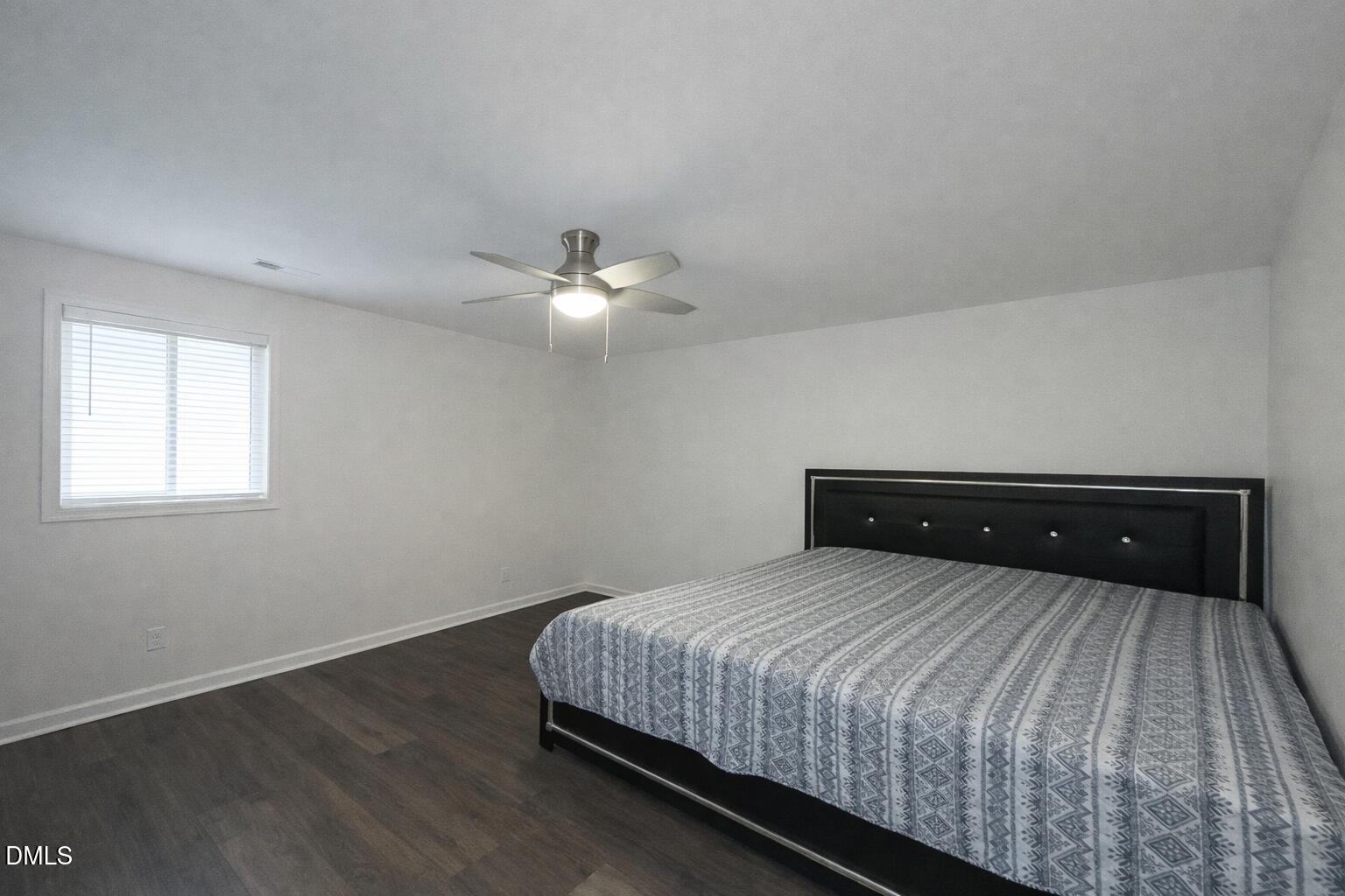 1696 James Winston Road Oxford, NC 27565 - Photo 15 of 19 a bedroom with a bed and lamps