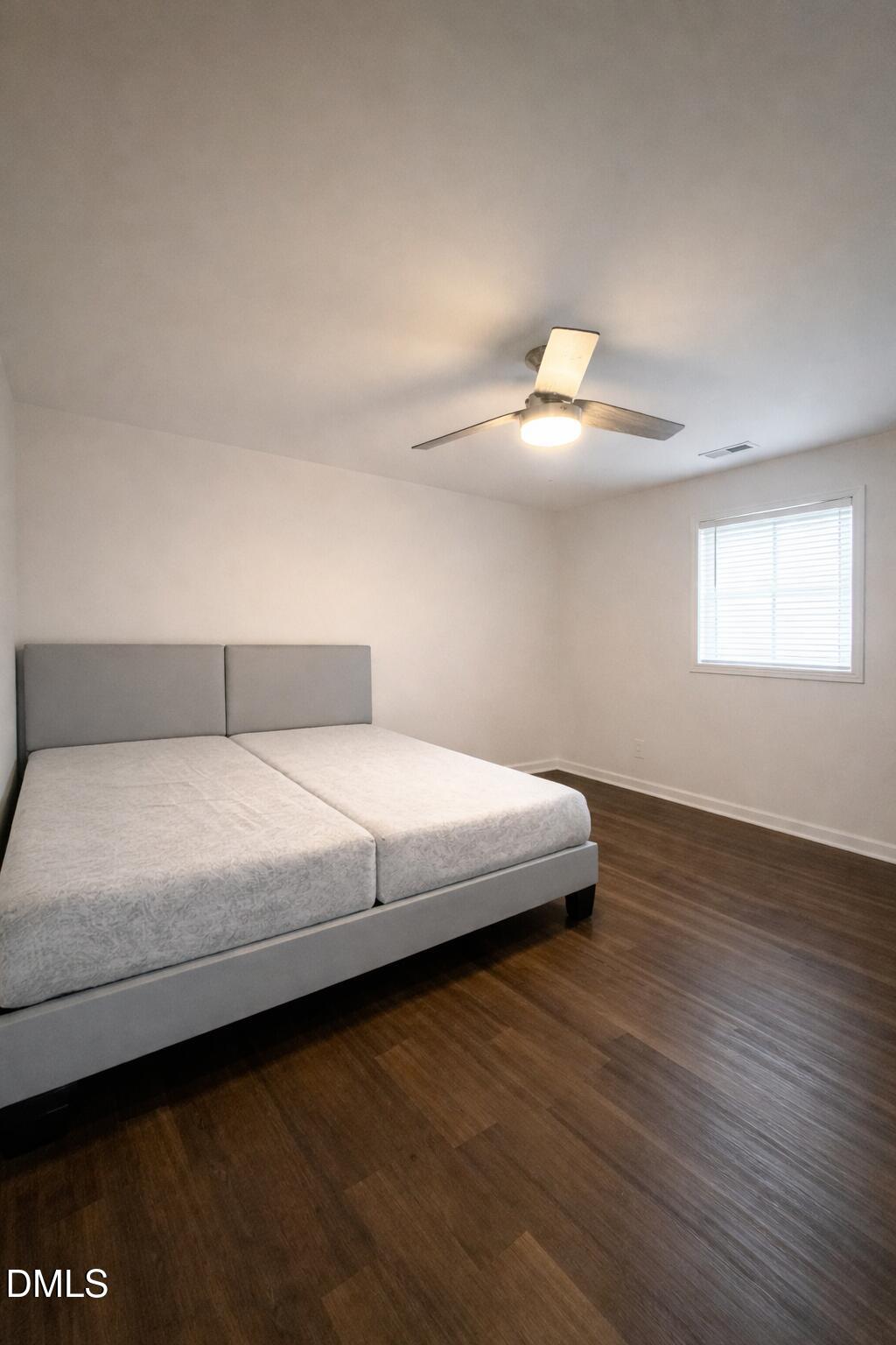 1696 James Winston Road Oxford, NC 27565 - Photo 19 of 19 a bedroom with a bed and a night stand