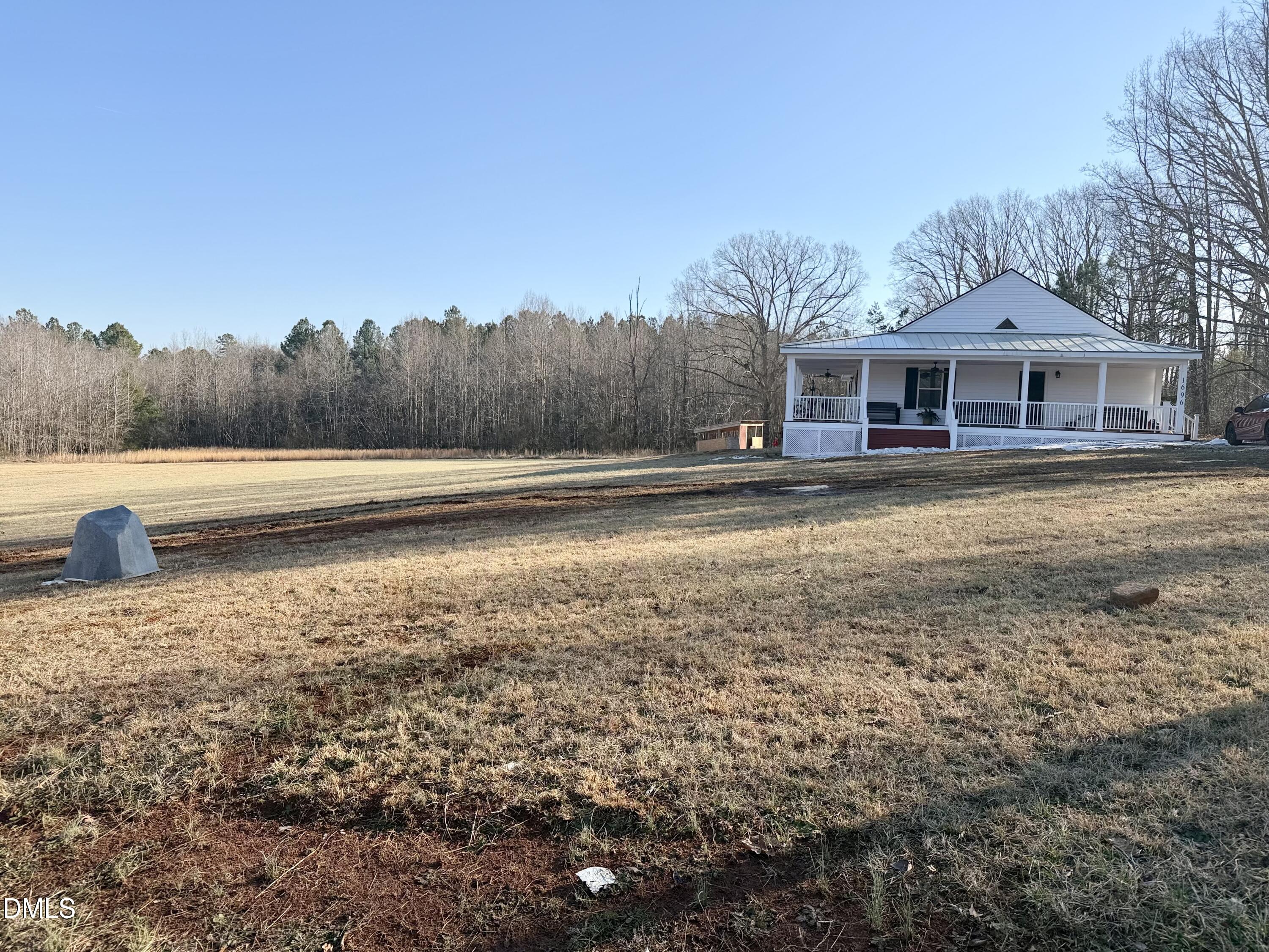 1696 James Winston Road Oxford, NC 27565 - Photo 2 of 19 a front view of a house with a yard