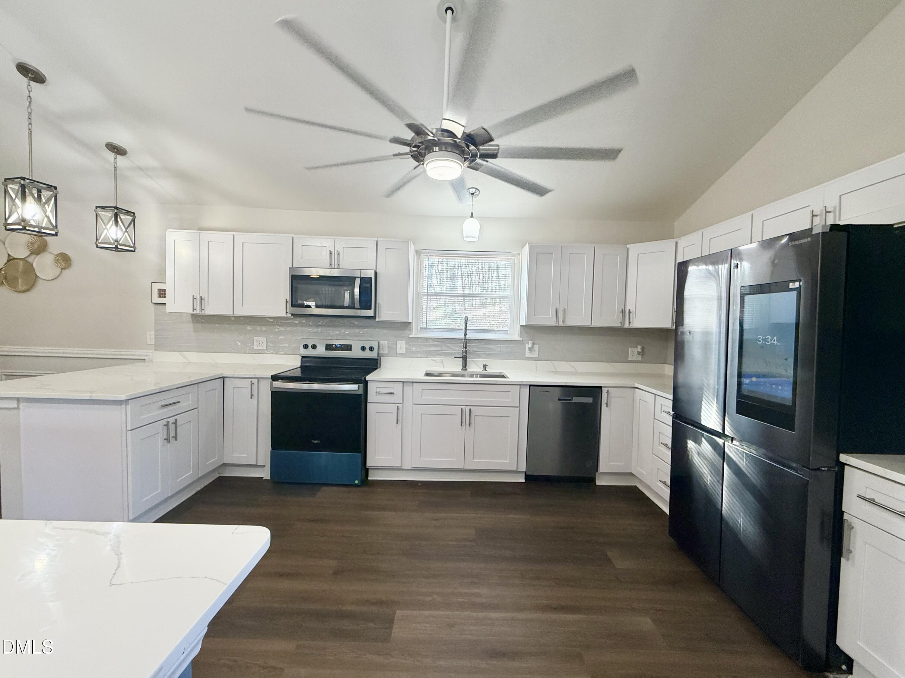 1696 James Winston Road Oxford, NC 27565 - Photo 8 of 19 a kitchen with a refrigerator stove and microwave