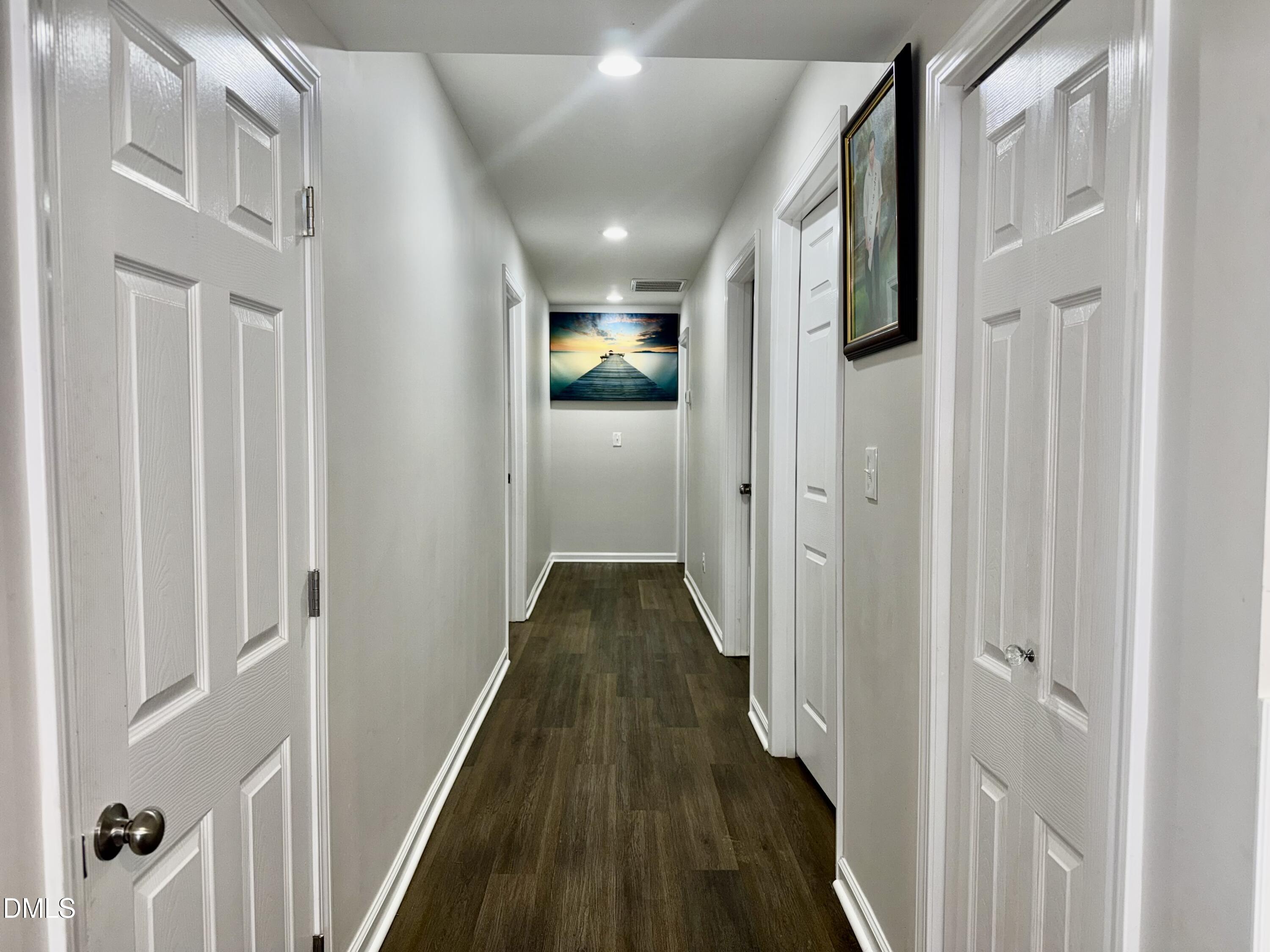1696 James Winston Road Oxford, NC 27565 - Photo 9 of 19 a view of a hallway with wooden floor and staircase