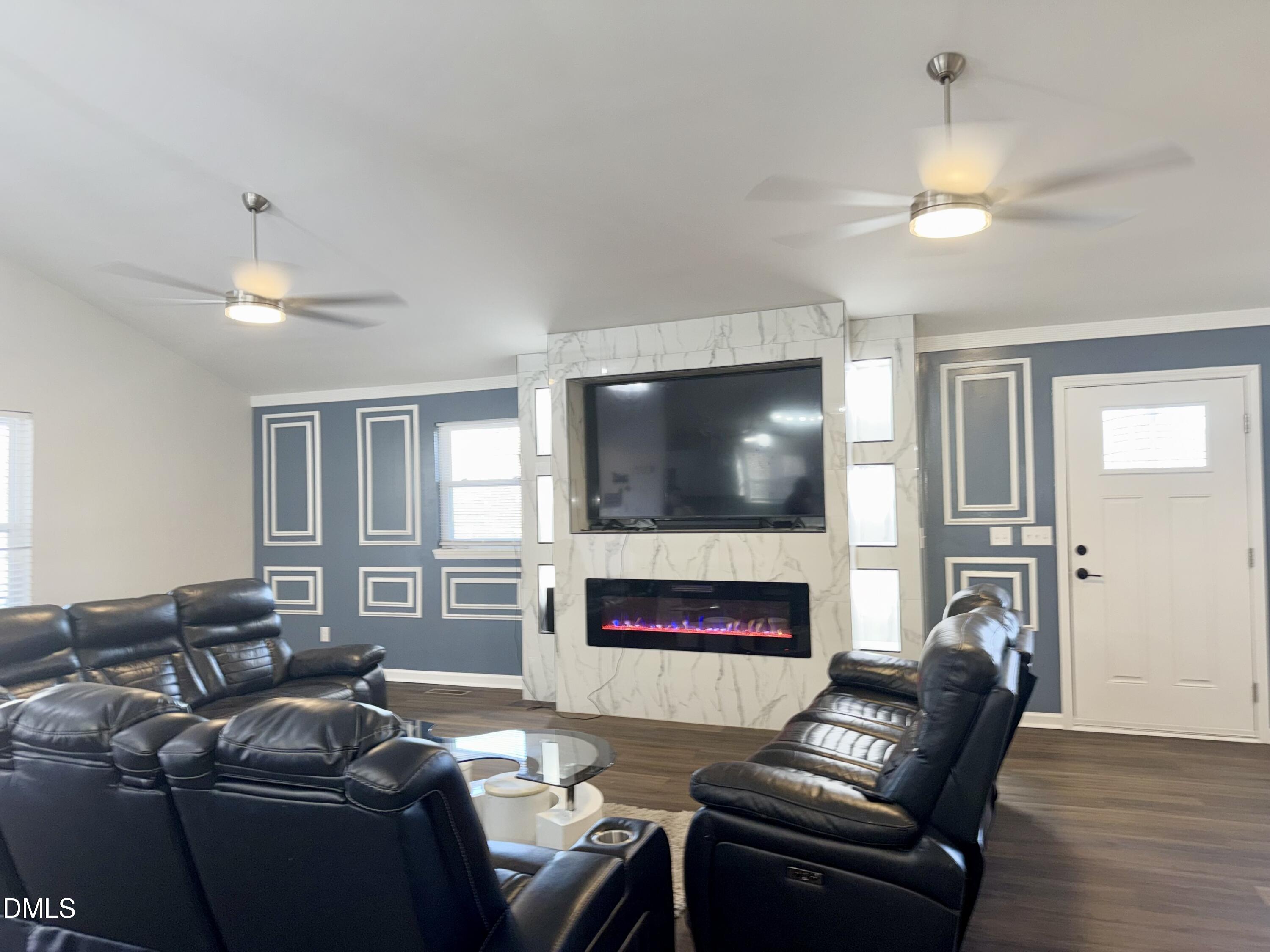 1696 James Winston Road Oxford, NC 27565 - Photo 10 of 19 a living room with furniture and a flat screen tv