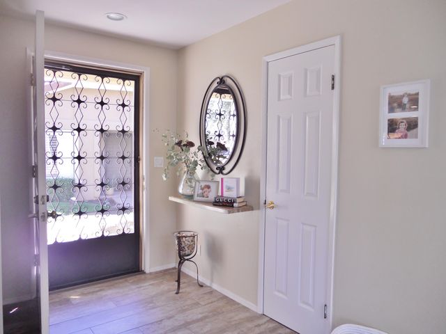 a dining room with furniture a window and kitchen view