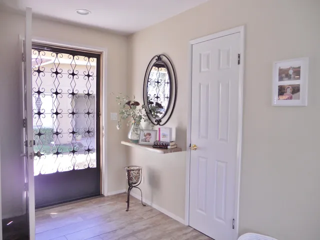 a dining room with furniture a window and kitchen view