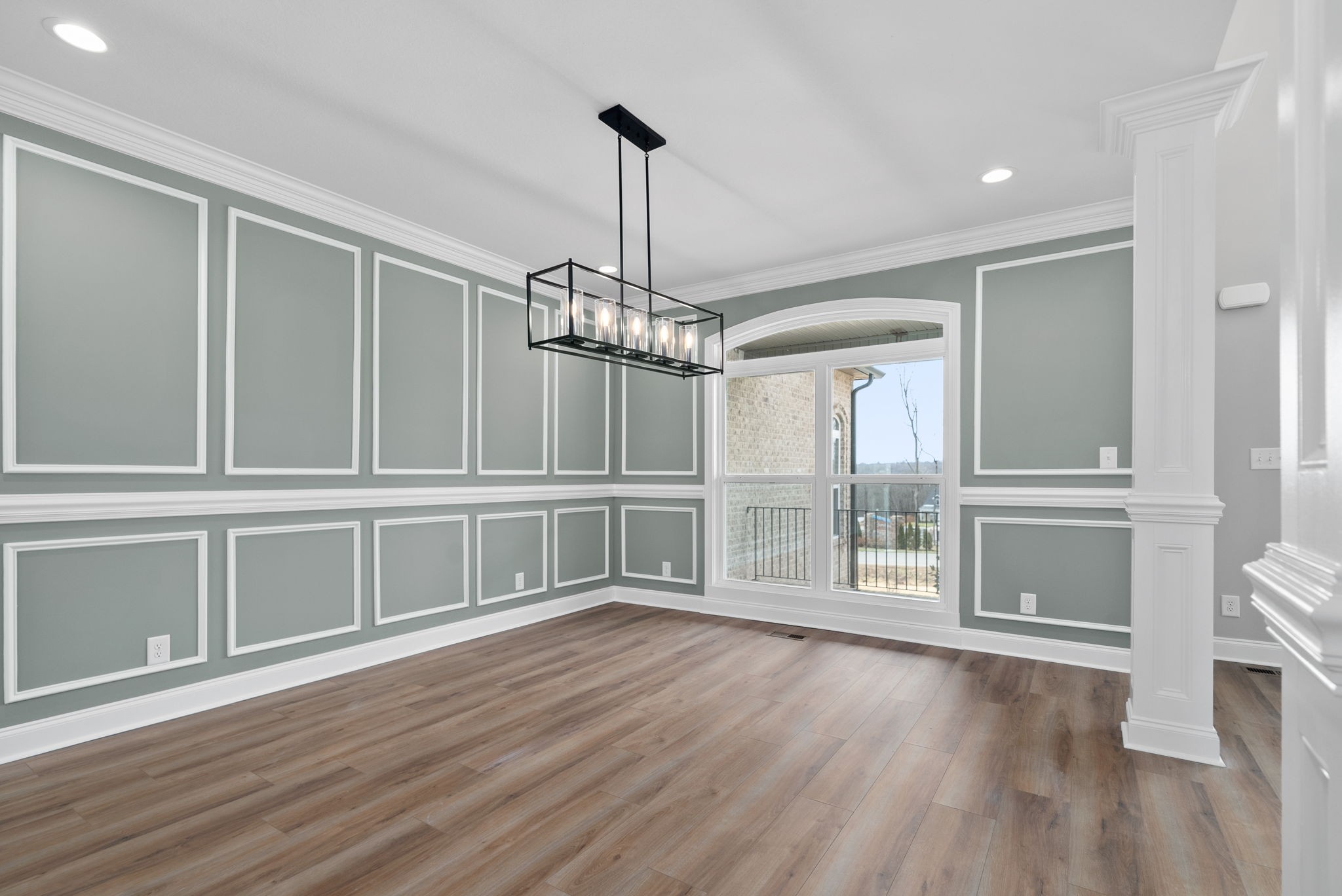 1031 Gratton Road Clarksville, TN 37043 - Photo 8 of 46 a view of an empty room with wooden floor and a window