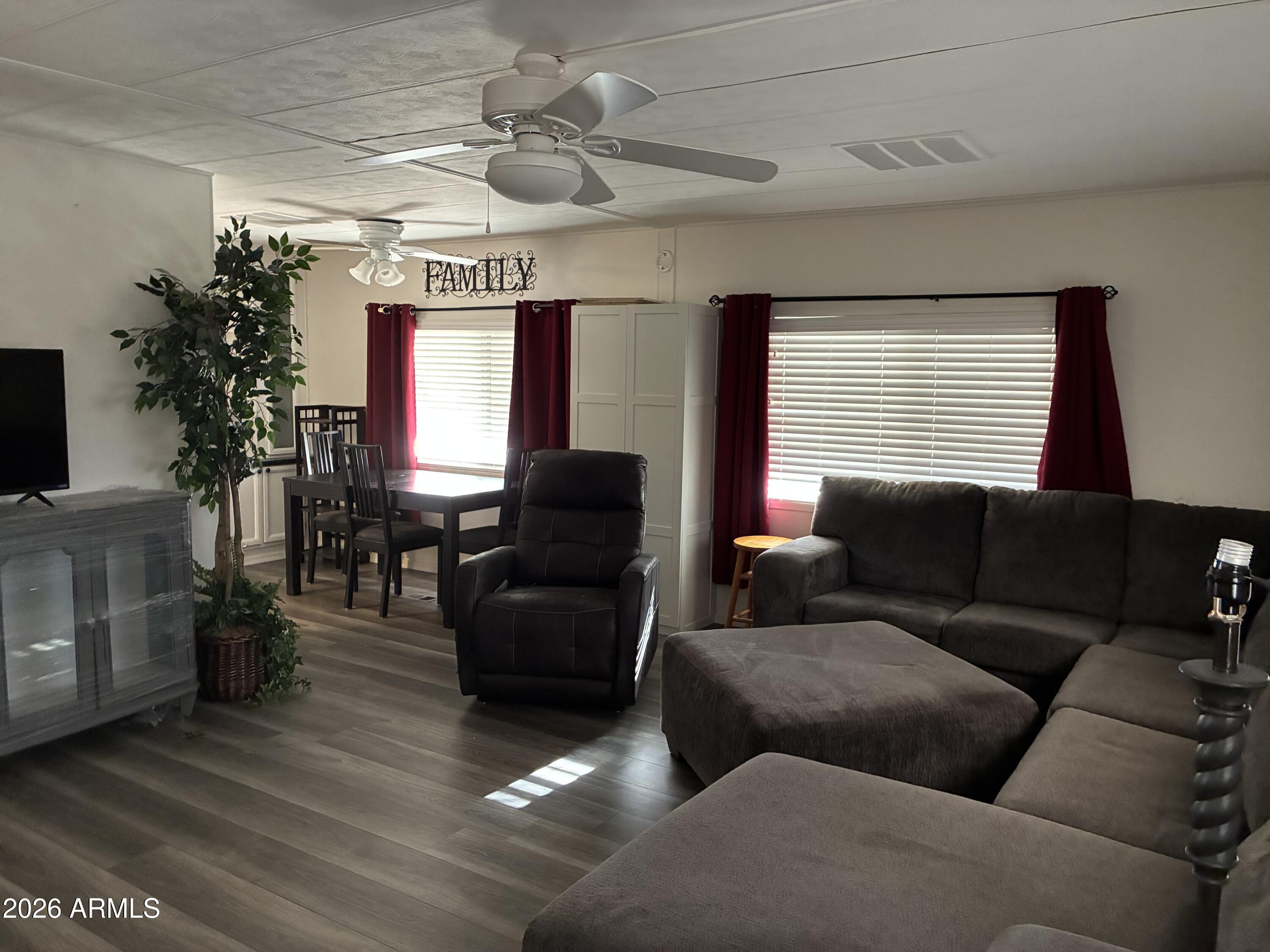 53 North Mountain Road, Unit 58 Apache Junction, AZ 85120 - Photo 5 of 39 a living room with furniture and a large window