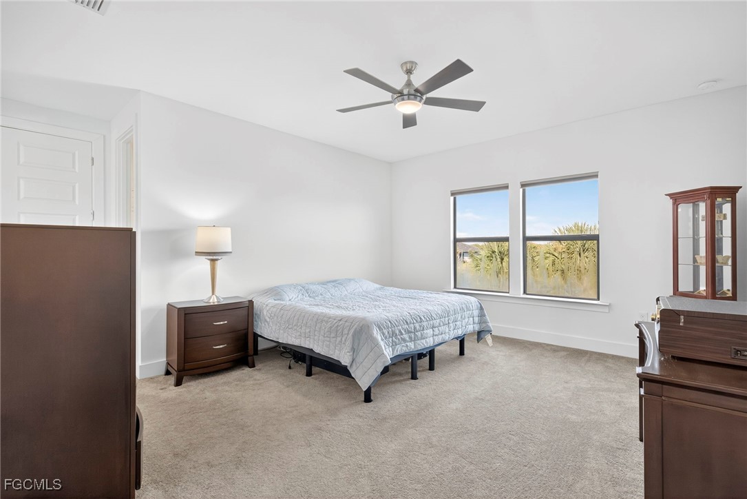 4351 Washington Place Ave Maria, FL 34142 - Photo 16 of 44 a spacious bedroom with a bed and window