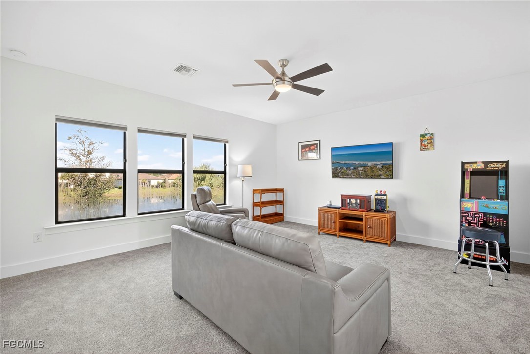 4351 Washington Place Ave Maria, FL 34142 - Photo 22 of 44 a living room with furniture and a window