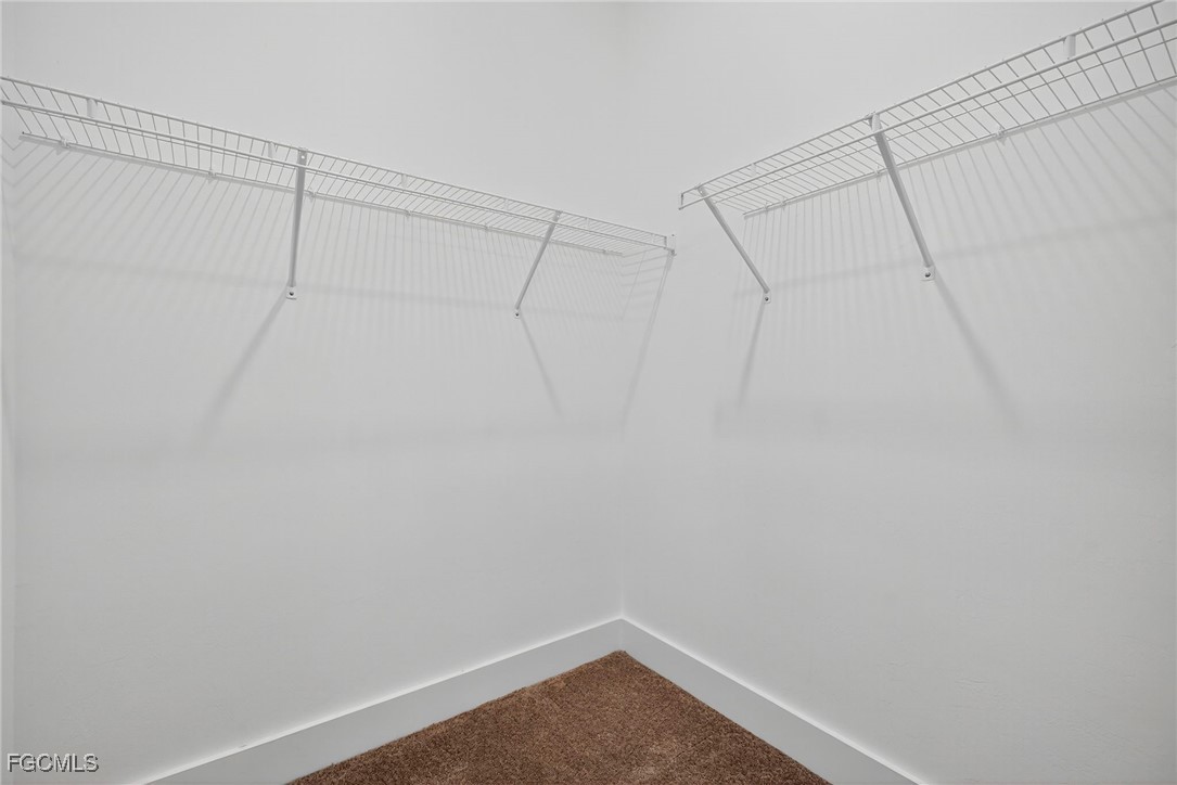 4351 Washington Place Ave Maria, FL 34142 - Photo 26 of 44 a view of a room with racks on the wall