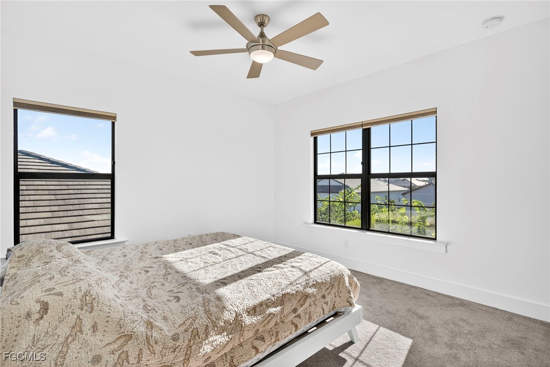 4351 Washington Place Ave Maria, FL 34142 - Photo 27 of 44 a bedroom with a bed and a window