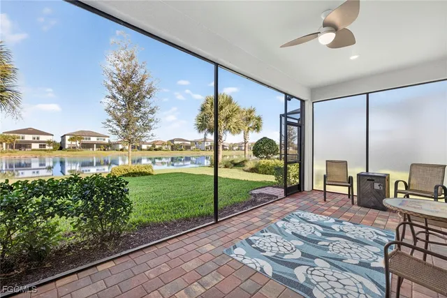 a view of a porch with a table and chairs