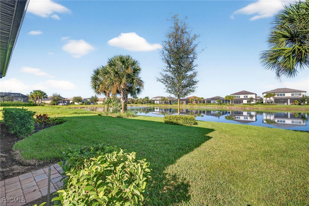4351 Washington Place Ave Maria, FL 34142 - Photo 36 of 44 a view of a garden with houses