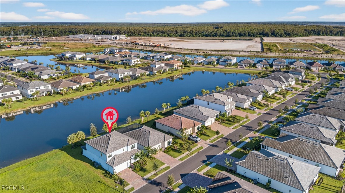 4351 Washington Place Ave Maria, FL 34142 - Photo 39 of 44 an aerial view of a house with a swimming pool yard and outdoor seating