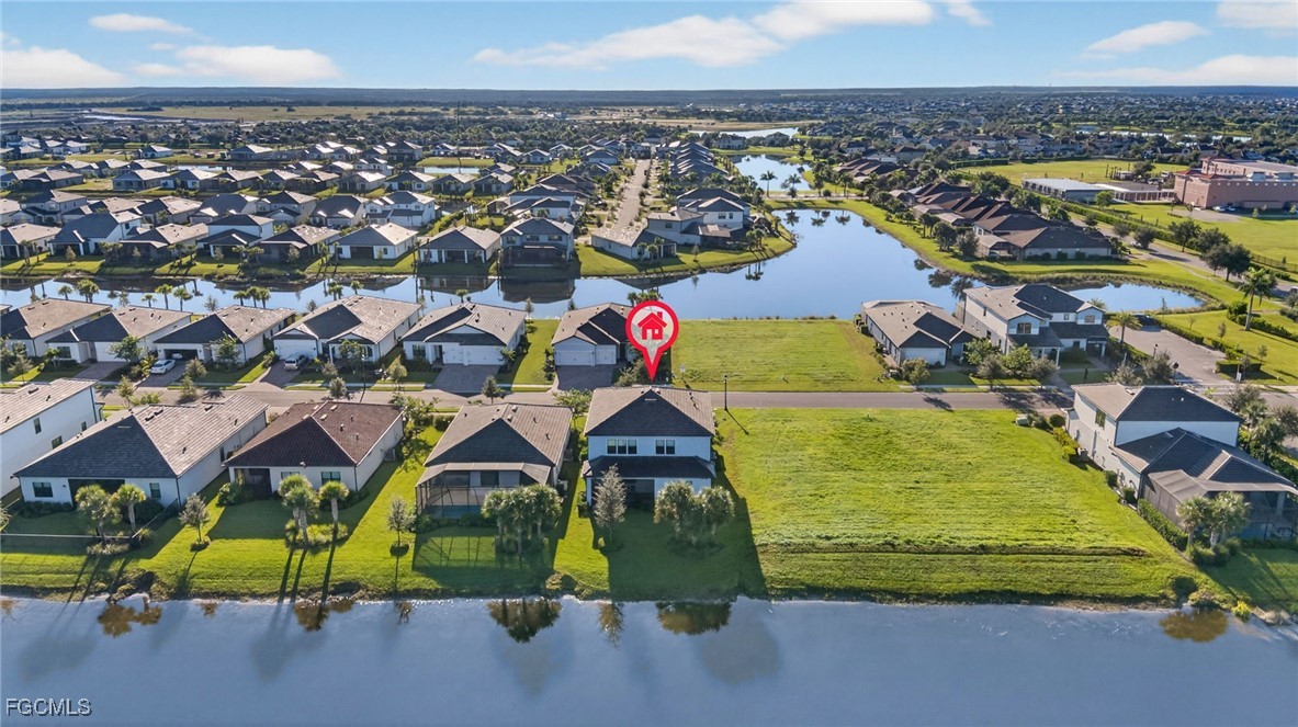 4351 Washington Place Ave Maria, FL 34142 - Photo 43 of 44 an aerial view of residential houses with outdoor space and swimming pool
