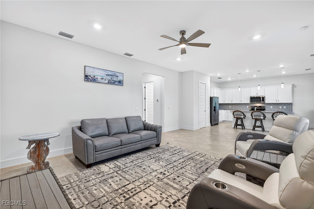 4351 Washington Place Ave Maria, FL 34142 - Photo 5 of 44 a living room with furniture and kitchen view