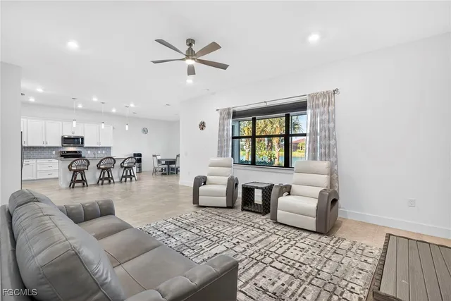 a living room with furniture and a window