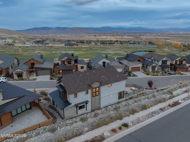 an aerial view of a house with outdoor space