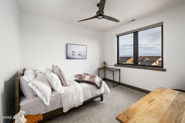 a bedroom with bed and a window