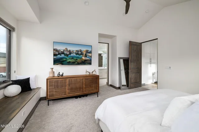 a bedroom with bed and window