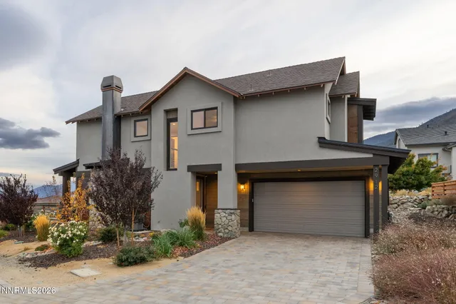 a front view of a house with a garage