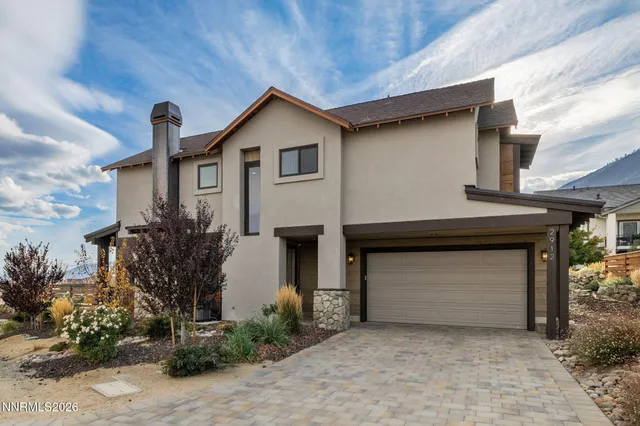 a front view of a house with a garage
