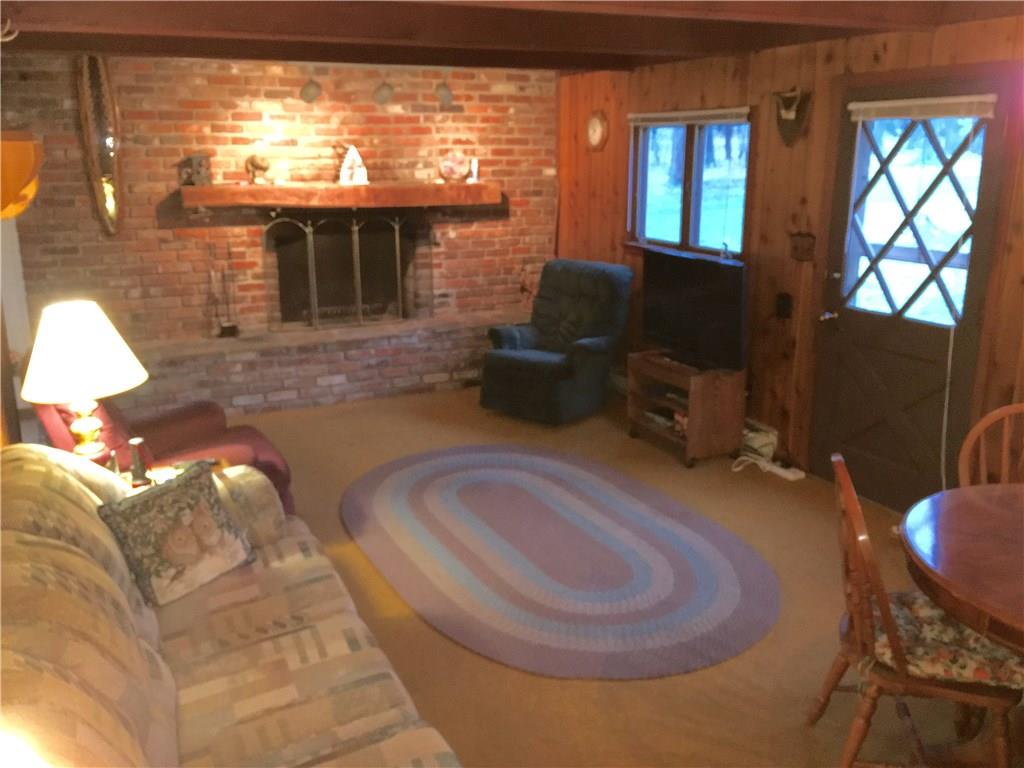 720 Alpine Road Boswell, PA 15531 - Photo 13 of 25 Living Room with a fireplace to enjoy cool evenings!