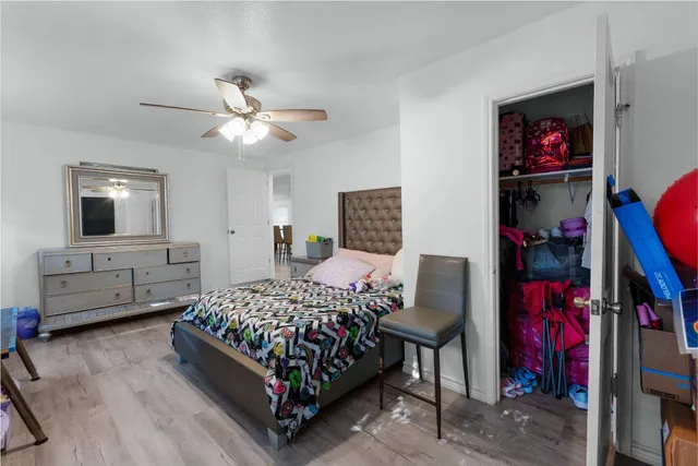 a bedroom with bed and a tv