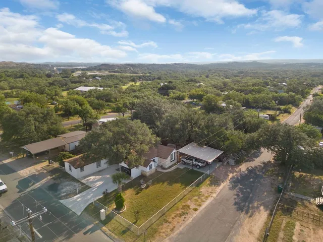 an aerial view of residential houses with outdoor space