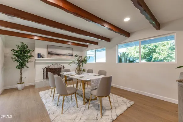 a view of a dining room with furniture window and outside view