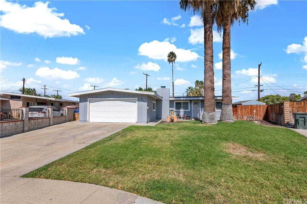 8263 Helena Avenue Riverside, CA 92504 - Photo 1 of 1 a view of a house with a backyard and trees