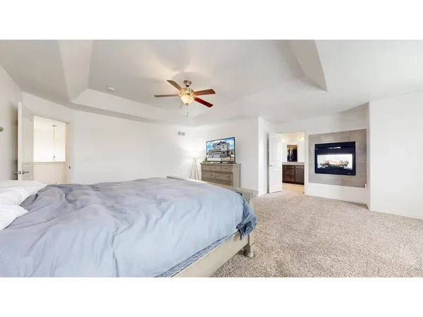 a living room with a bed furniture and a window
