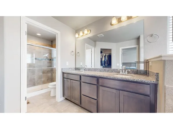 a bathroom with a sink and a large mirror