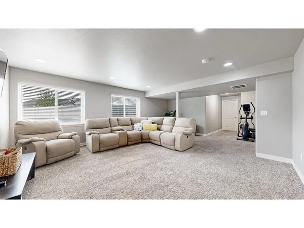 a living room with furniture and a window