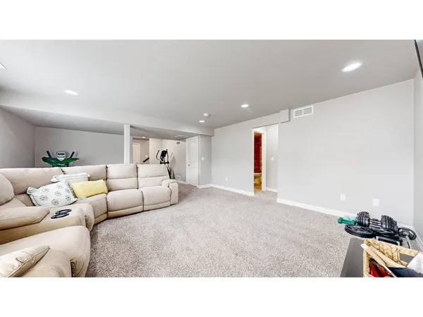 a living room with furniture and a rug