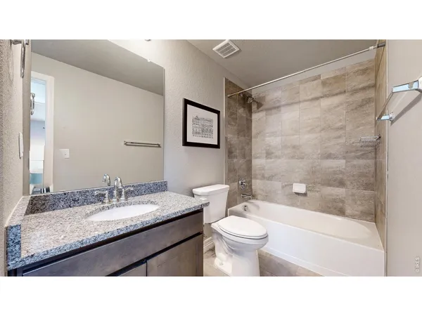 a bathroom with a sink a toilet and a bathtub