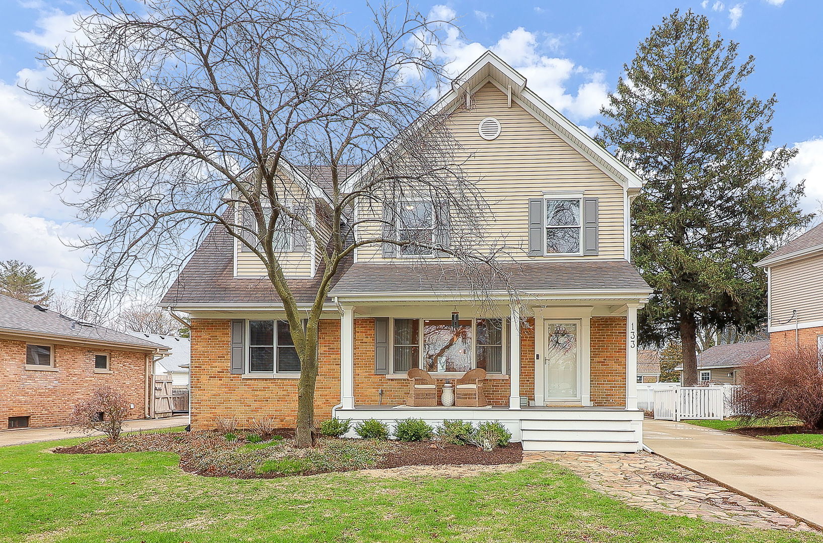 front view of a house with a yard