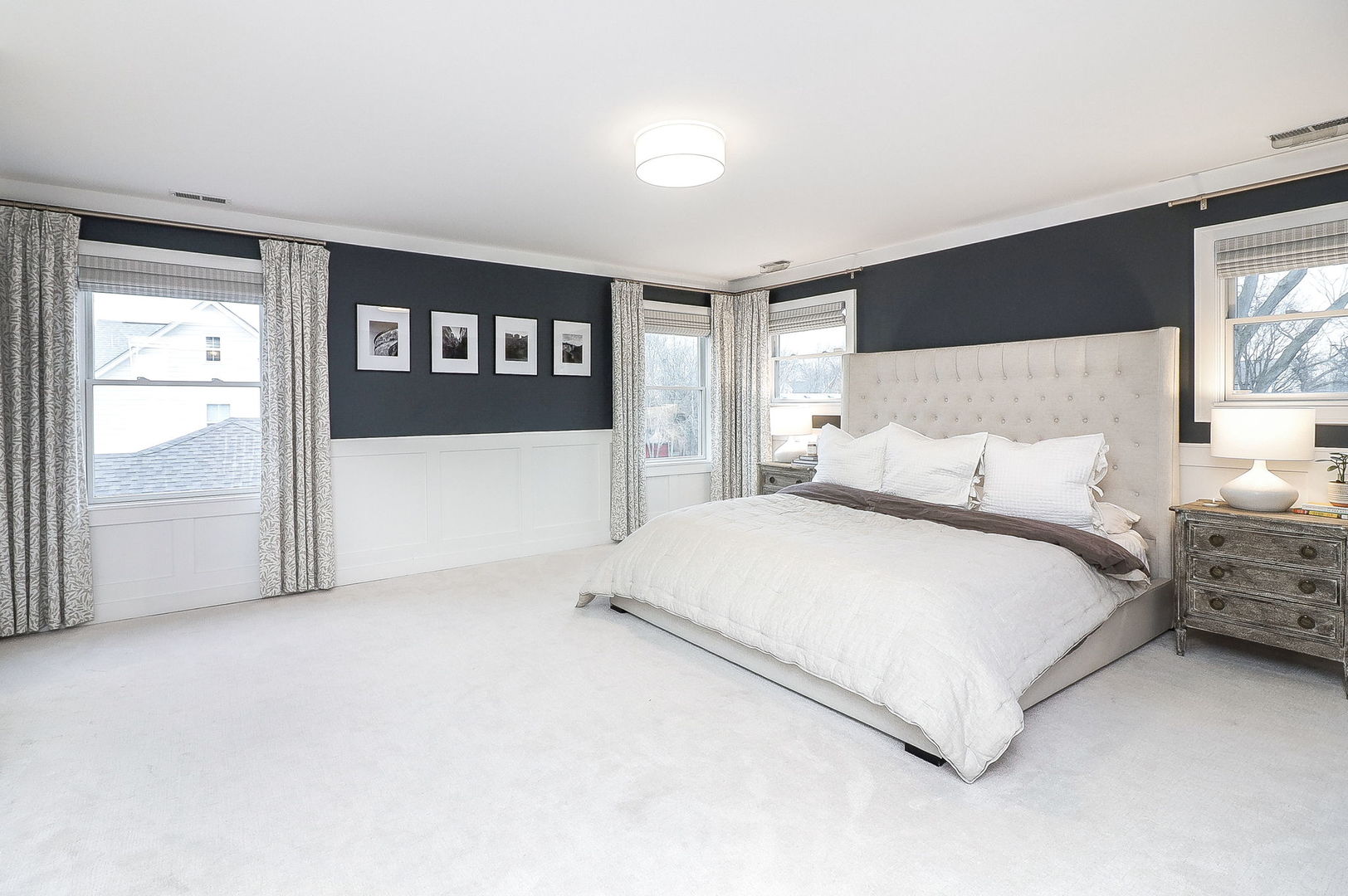 133 South Williston Street Wheaton, IL 60187 - Photo 18 of 43 a large bed sitting in a bedroom next to a window