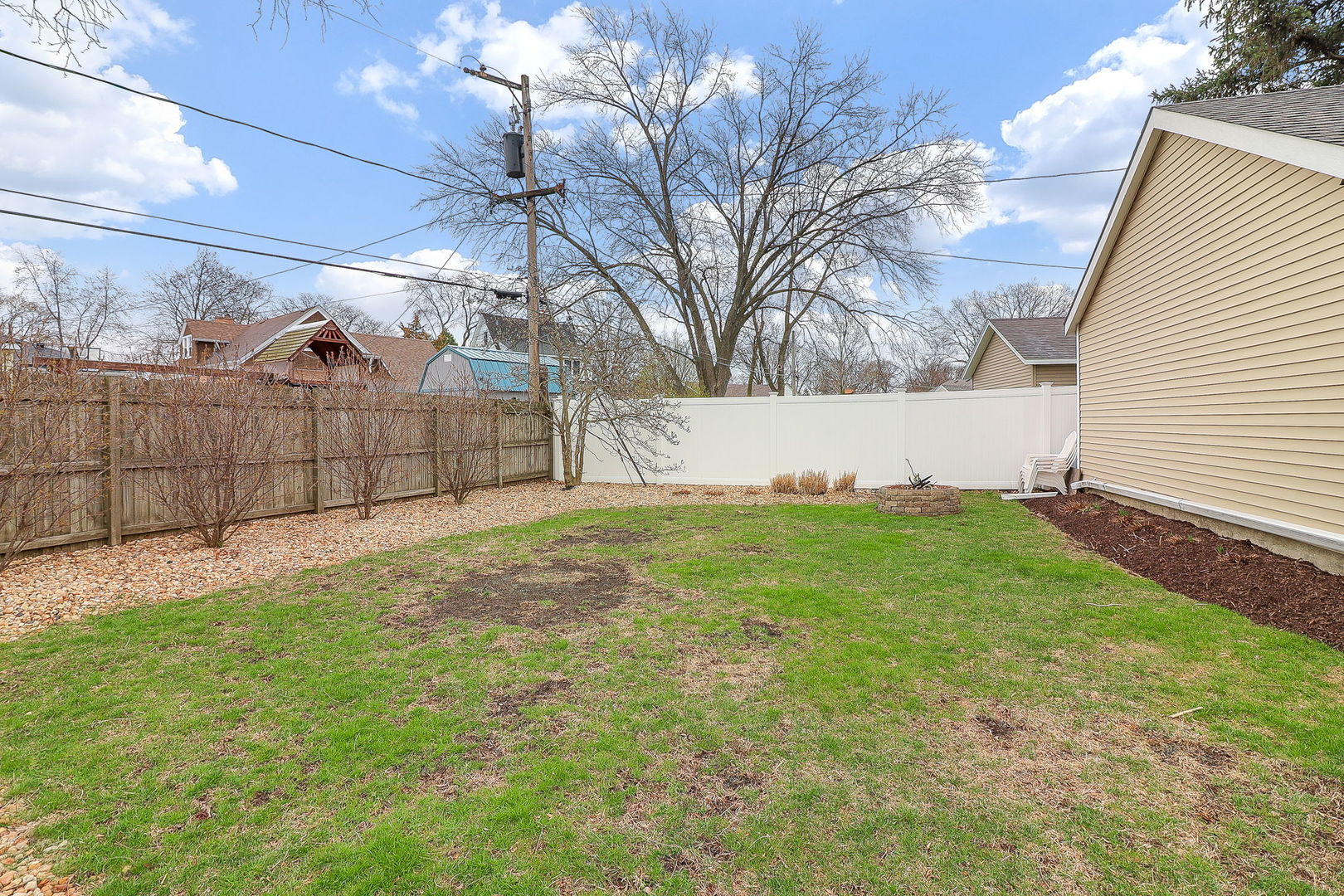 133 South Williston Street Wheaton, IL 60187 - Photo 29 of 43 a view of a backyard with a large tree