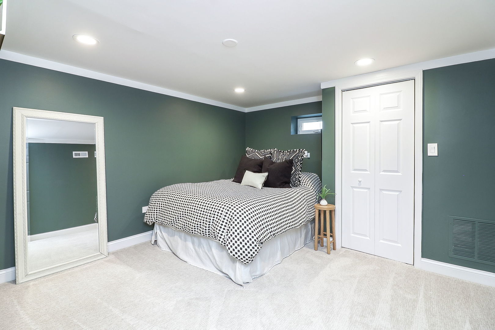 133 South Williston Street Wheaton, IL 60187 - Photo 30 of 43 a bedroom with a large bed and a chandelier