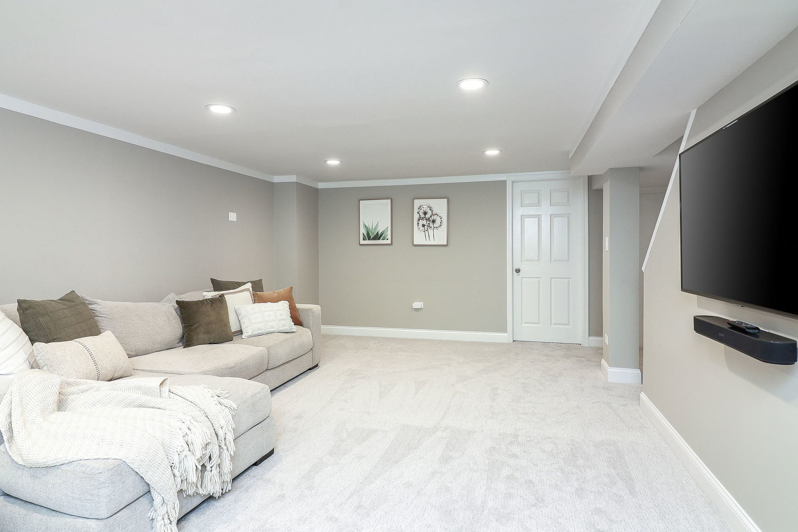 133 South Williston Street Wheaton, IL 60187 - Photo 33 of 43 a living room with furniture a flat screen tv and a refrigerator