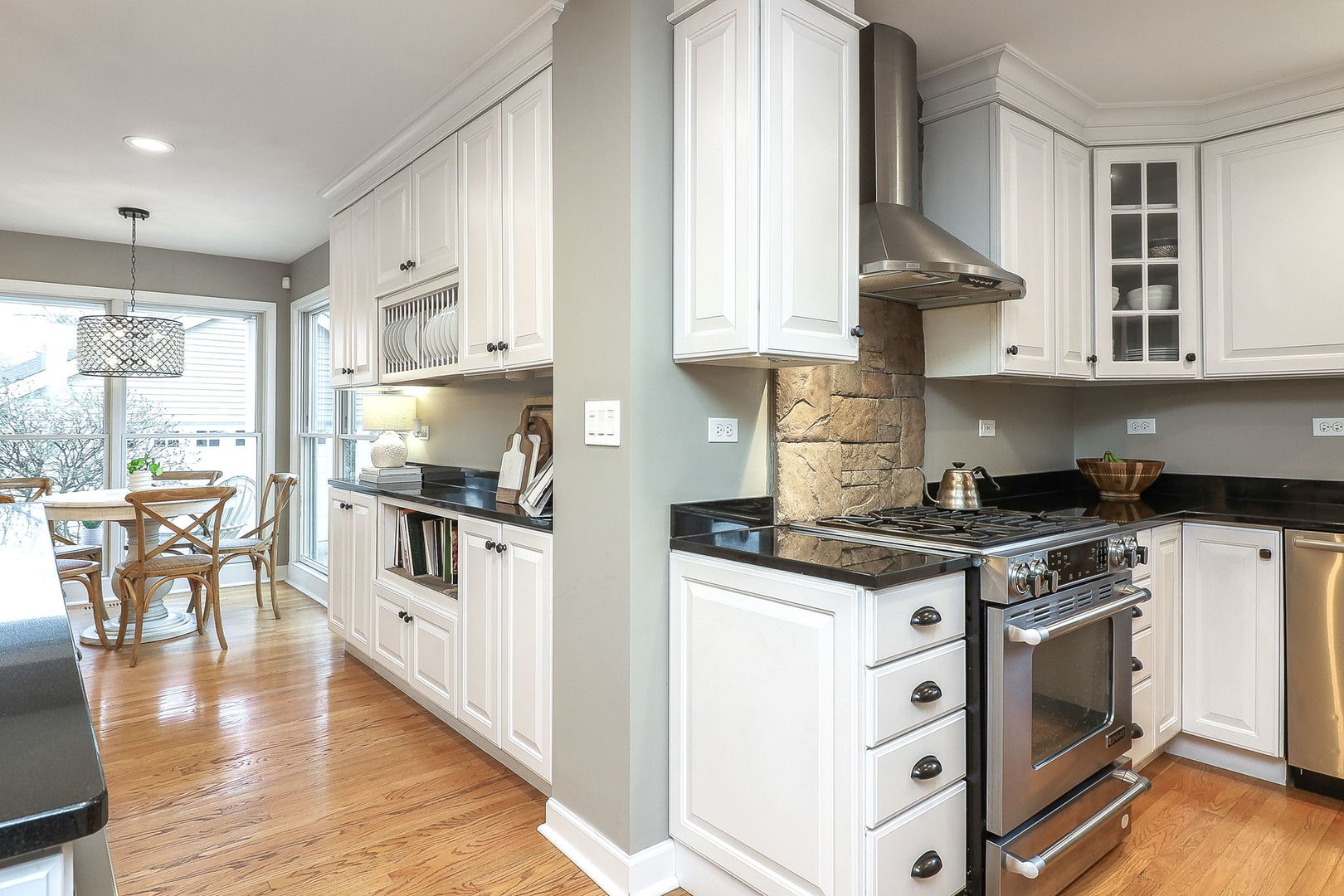 133 South Williston Street Wheaton, IL 60187 - Photo 6 of 43 a kitchen with stainless steel appliances a stove a sink and a refrigerator