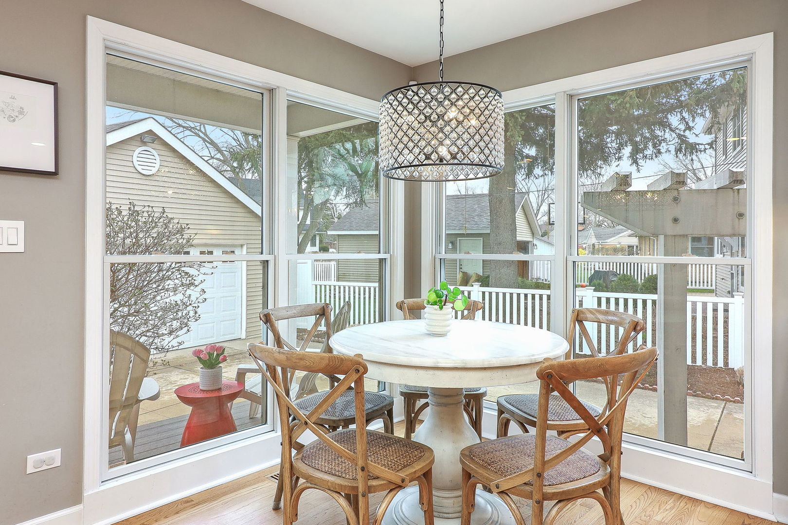 133 South Williston Street Wheaton, IL 60187 - Photo 8 of 43 a view of a dining room with furniture large windows and wooden floor