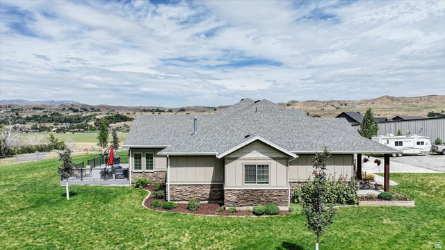 3123 East Riverdale Road Preston, ID 83263 - Photo 47 of 52 Spacious single-story residence featuring a shingle roof and a combination of siding and stone veneer exterior
