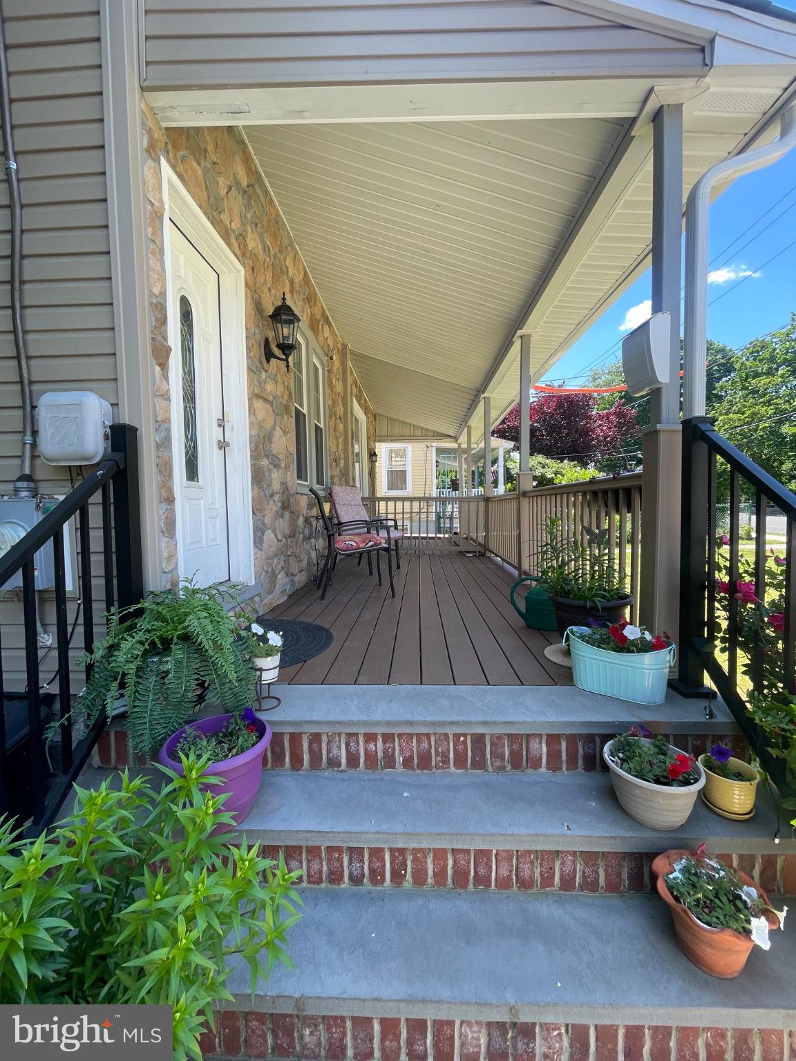 8129 Pine Road Philadelphia, PA 19111 - Photo 3 of 40 Charming porch with vibrant blooms.