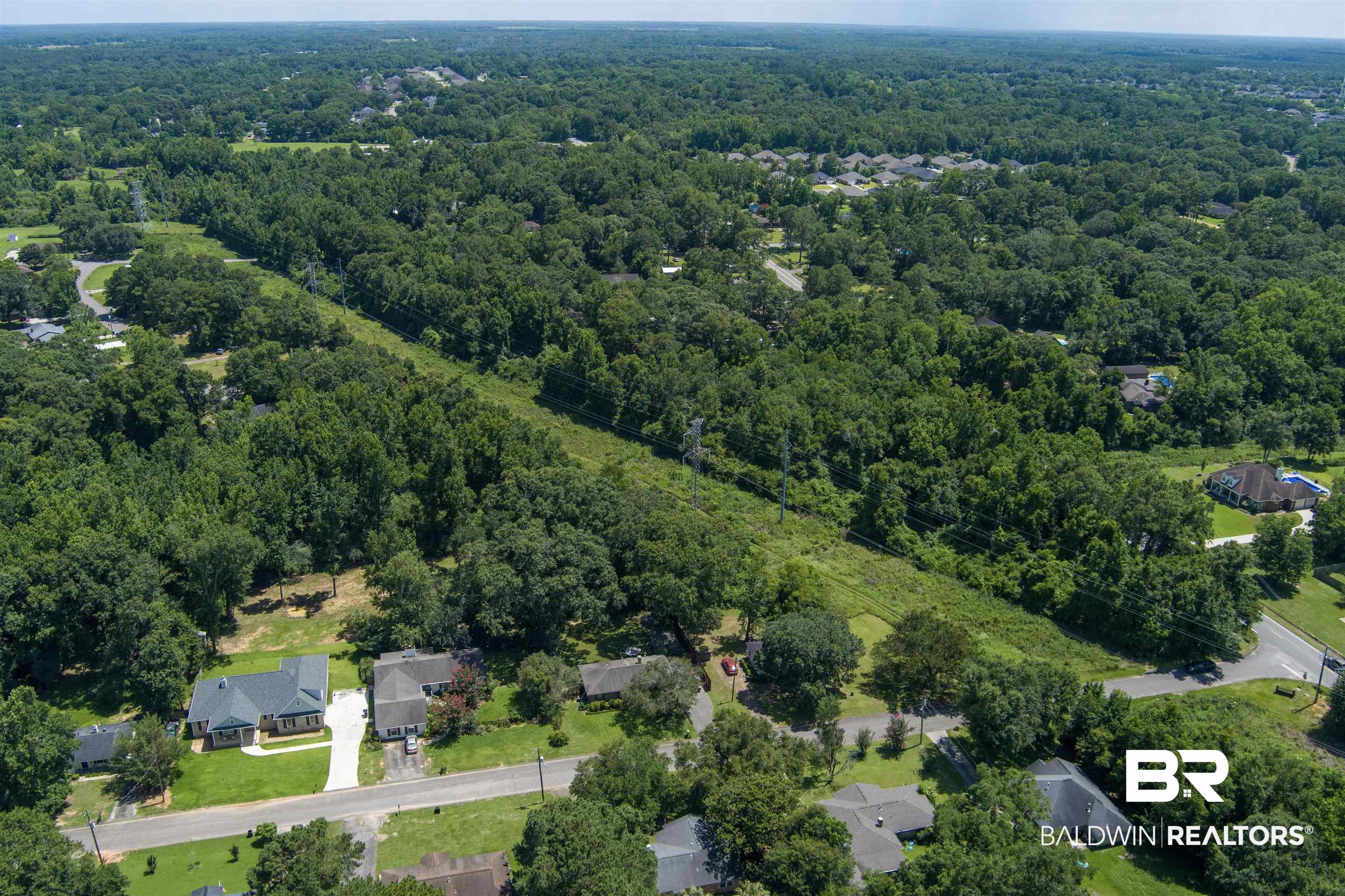 0 McFarland Road Mobile, AL 36695 - Photo 5 of 11 Aerial view of property and surrounding area with a forest