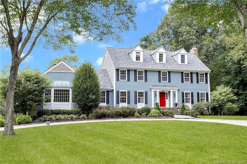 174 Deforest Road Wilton, CT 06897 - Photo 1 of 1 a front view of house with yard and green space