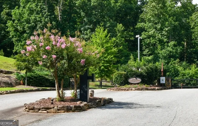 an aerial view of a houses with a lake view