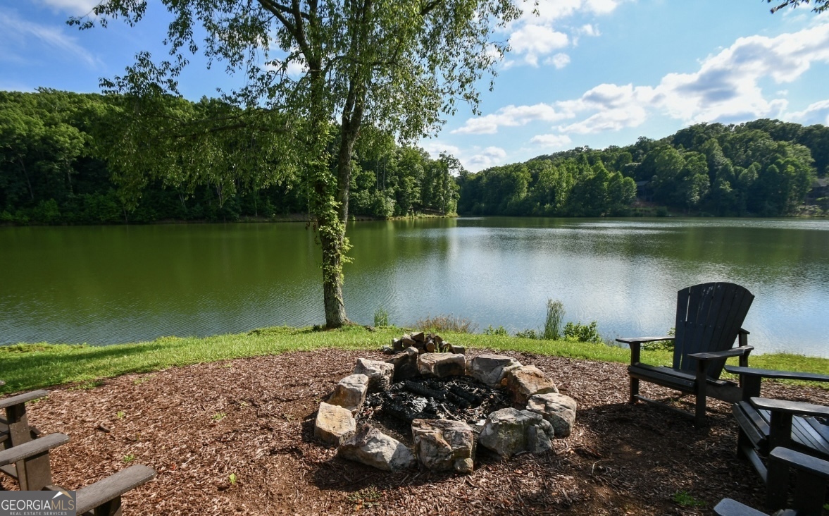 58 Mountainside Drive Cleveland, GA 30528 - Photo 20 of 30 a view of a lake with a yard and outdoor seating